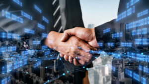 Business handshake over cityscape with digital data overlay